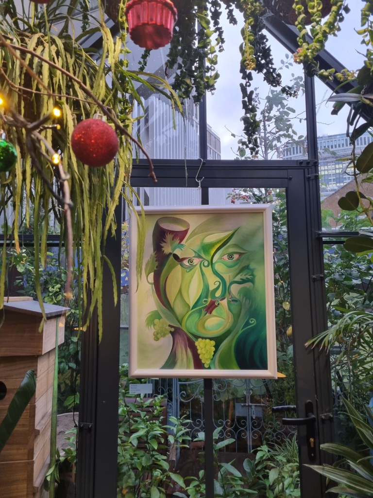 An oil painting of Bacchus hanging in the Orangery.